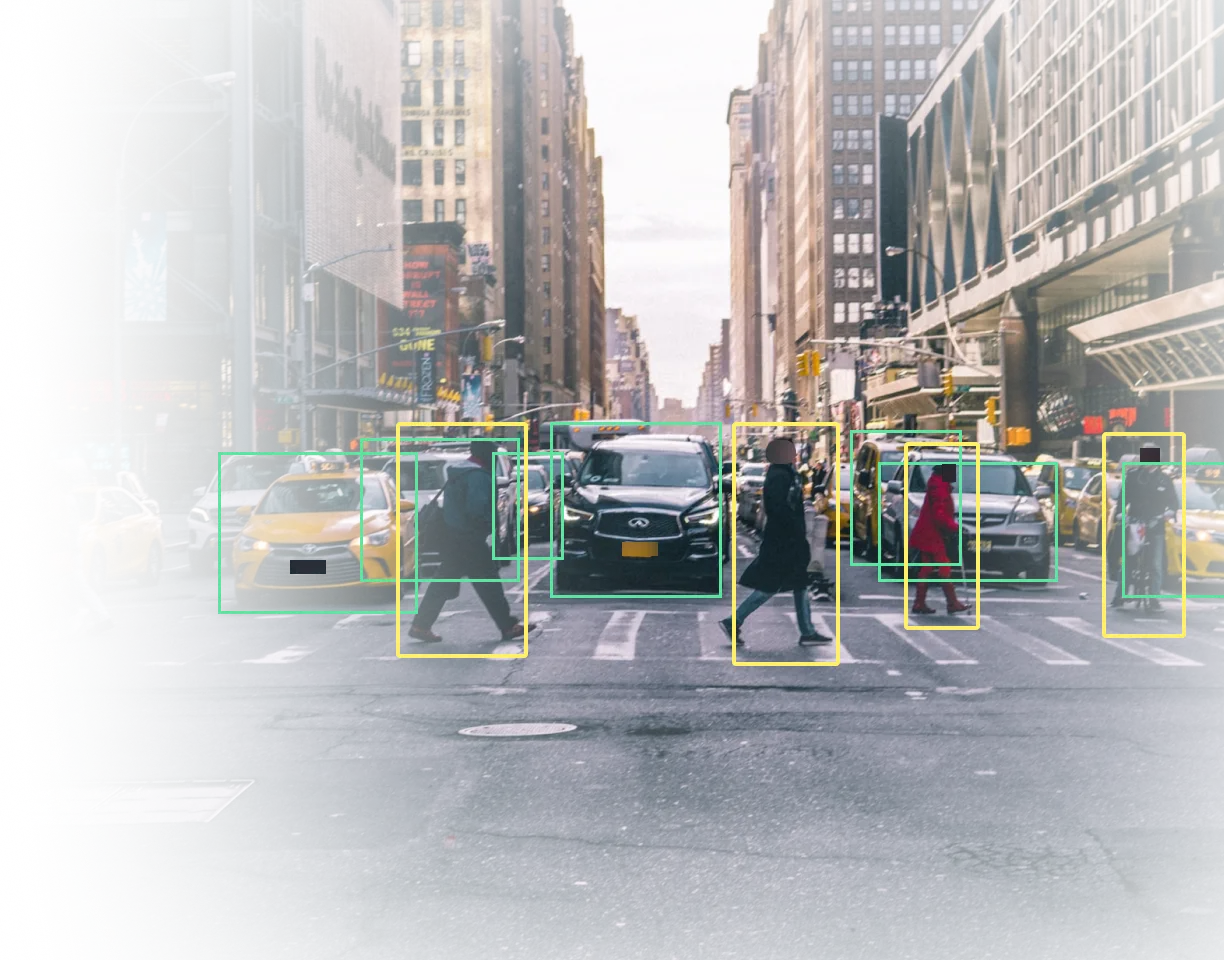  Image of a pedestrian crossing and traffic with bounding boxes around pedestrians